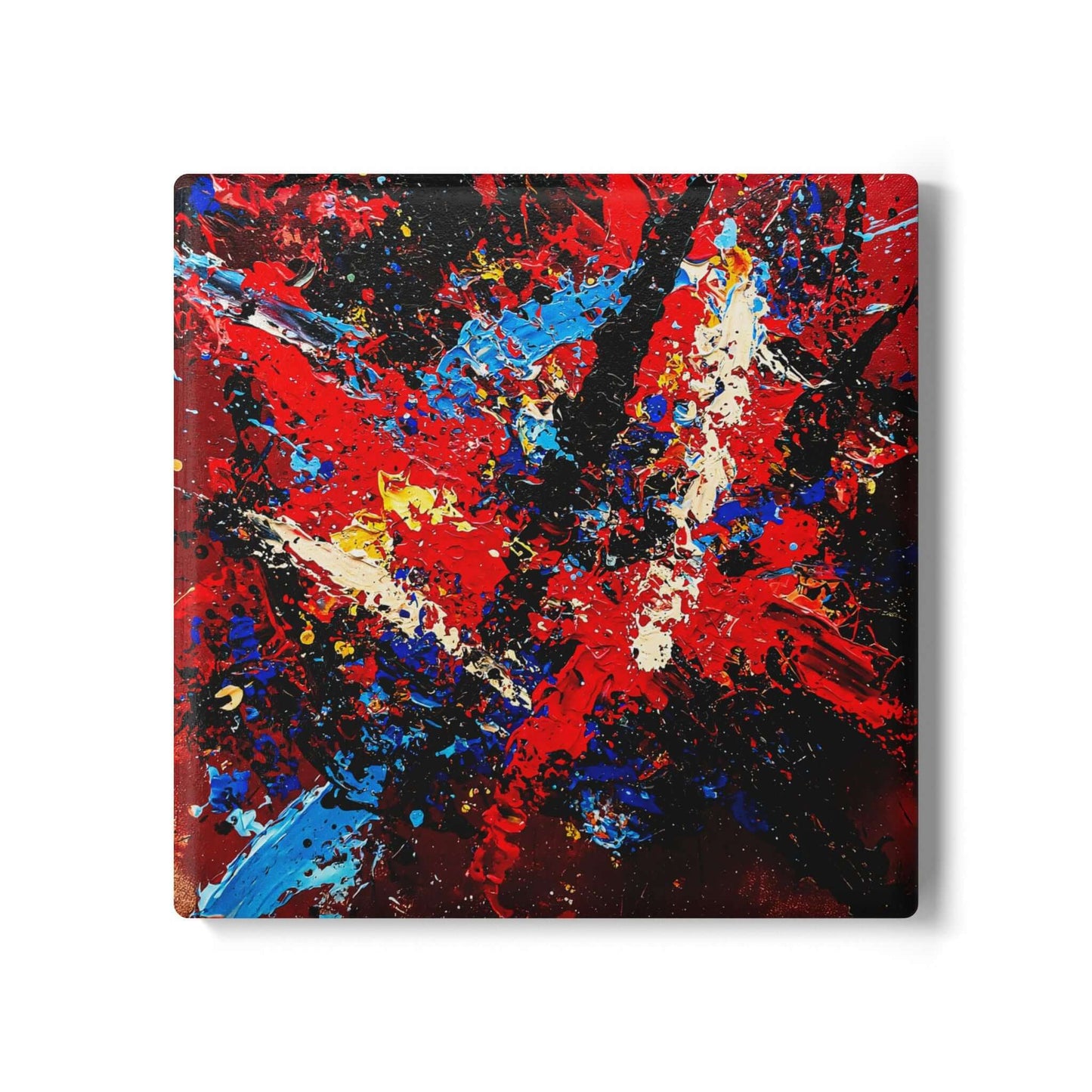 Ceramic coaster 'Reignite' with bold red, blue, and ivory abstract design; perfect gift for seniors.