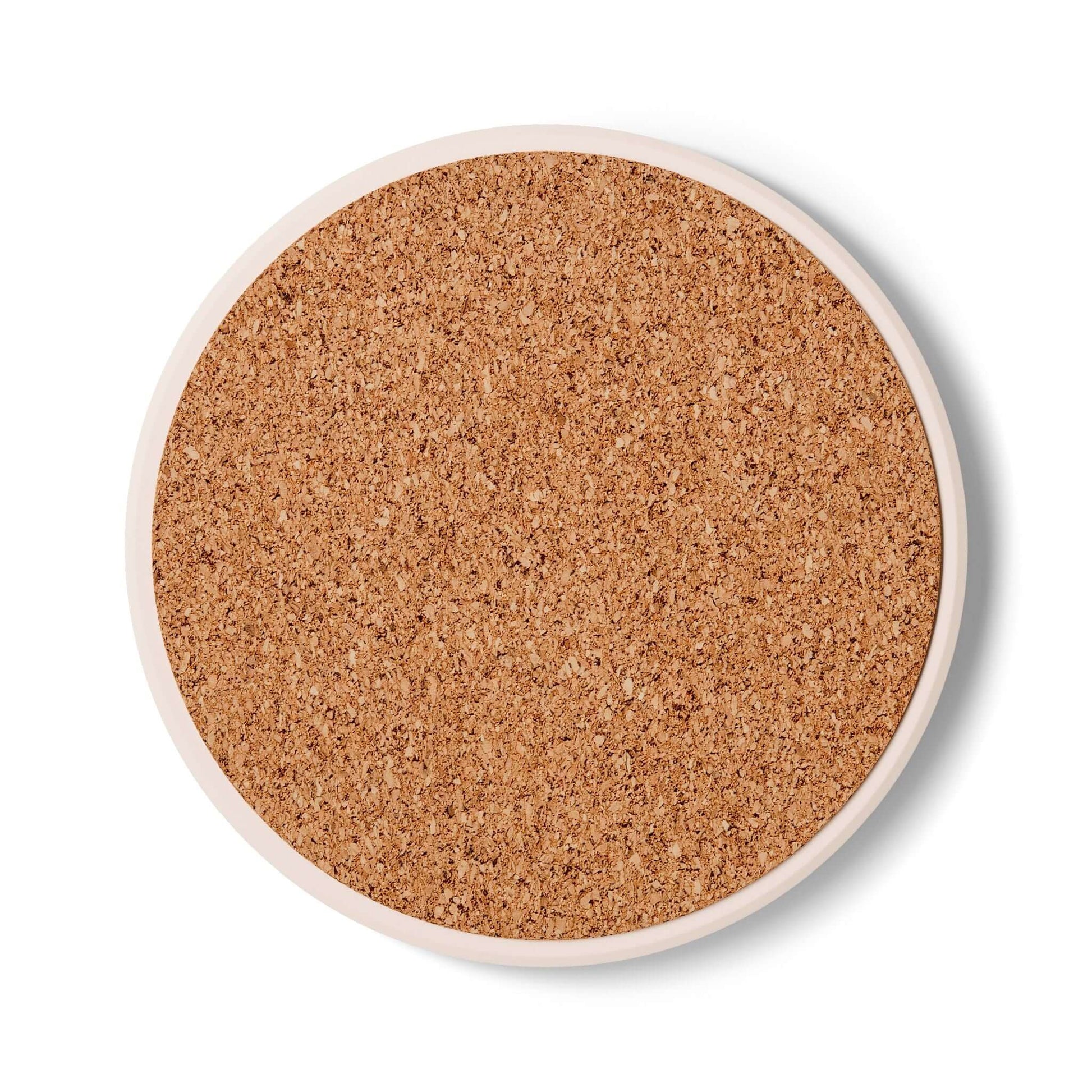 Round cork coaster with smooth surface, ideal for seniors' drinkware as a safe, decorative surface.