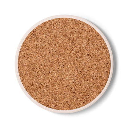 Round cork coaster with smooth surface, ideal for seniors' drinkware as a safe, decorative surface.